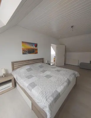 Ein Bett oder Betten in einem Zimmer der Unterkunft Ferienhaus im Kirschbäumchen