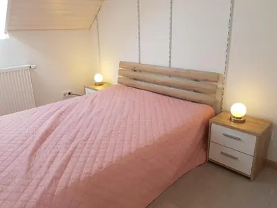 Ein Bett oder Betten in einem Zimmer der Unterkunft Ferienhaus im Kirschbäumchen