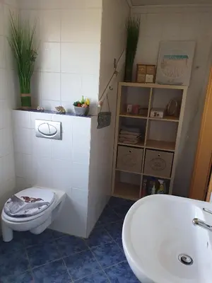 Ein Badezimmer in der Unterkunft FeWo Weismark