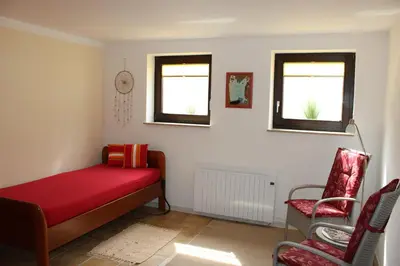 Ein Bett oder Betten in einem Zimmer der Unterkunft Gästehaus Silbersbach
