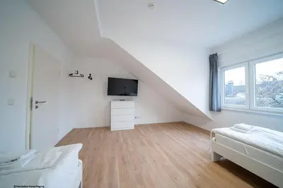 Ein Bett oder Betten in einem Zimmer der Unterkunft DQ03 - Geräumige Monteurwohnung Koblenz