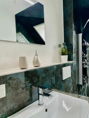 Ein Badezimmer in der Unterkunft Allegra Appartements, Region Bostalsee