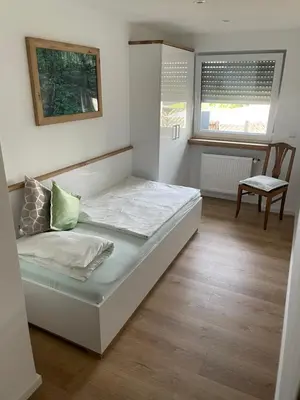 Ein Bett oder Betten in einem Zimmer der Unterkunft Ferienwohnung Bröder
