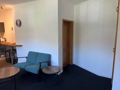 Ein Sitzbereich in der Unterkunft Hubertushaus