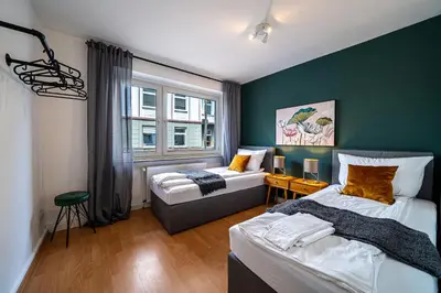 Ein Bett oder Betten in einem Zimmer der Unterkunft Coblenz Suites - Design Apartment City - 2 Bedrooms