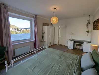 Ein Bett oder Betten in einem Zimmer der Unterkunft Voll ausgestattete Wohnung mit Moselblick