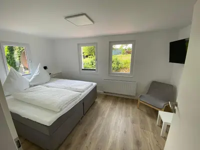 Ein Bett oder Betten in einem Zimmer der Unterkunft Ferienhaus Römer