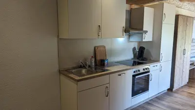 Küche/Küchenzeile in der Unterkunft Waldzeit Lodge - Ferienwohnung Hase