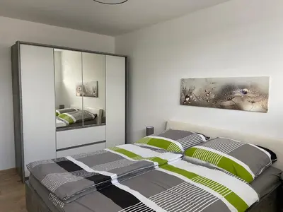 Ein Bett oder Betten in einem Zimmer der Unterkunft Ferienwohnung Zur alten Dorfschule