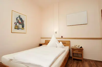 Ein Bett oder Betten in einem Zimmer der Unterkunft Vegan Hotel und Restaurants Nicolay 1881