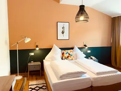Ein Bett oder Betten in einem Zimmer der Unterkunft Vegan Hotel und Restaurants Nicolay 1881