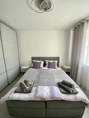 Ein Bett oder Betten in einem Zimmer der Unterkunft Ferienwohnung am Festungshang Ehrenbreitstein