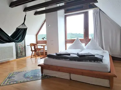 Ein Bett oder Betten in einem Zimmer der Unterkunft Haus mit idyllischem Seeblick