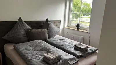 Ein Bett oder Betten in einem Zimmer der Unterkunft Schöne Ferienwohnung zentral in Koblenz (HG)