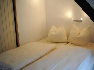 Ein Bett oder Betten in einem Zimmer der Unterkunft Chalet in Gerolstein forest holiday park