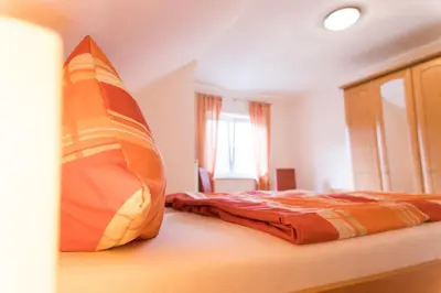 Ein Bett oder Betten in einem Zimmer der Unterkunft Ferienwohnungen Oswald Friederich