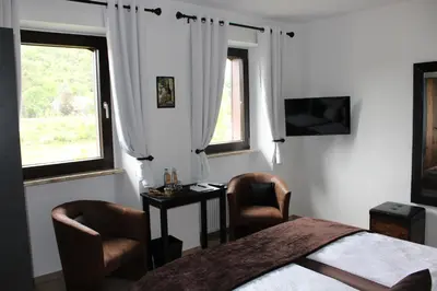 Ein Bett oder Betten in einem Zimmer der Unterkunft Bachmeier's Gasthaus Traube Niederfell