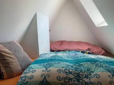 Ein Bett oder Betten in einem Zimmer der Unterkunft Ferienwohnung Rheinblick, Sport-Pool