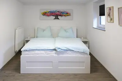 Ein Bett oder Betten in einem Zimmer der Unterkunft Görg Ferienwohnungen