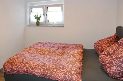 Ein Bett oder Betten in einem Zimmer der Unterkunft Görg Ferienwohnungen