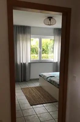 Ein Bett oder Betten in einem Zimmer der Unterkunft Moselidylle und Cityflair - Ferienwohnung Beth