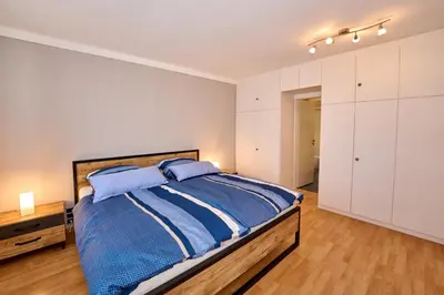 Ein Bett oder Betten in einem Zimmer der Unterkunft PanoramaSicht - Daun von oben