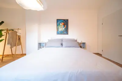 Ein Bett oder Betten in einem Zimmer der Unterkunft Stylish Apartment by the Rhine River