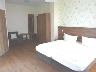 Ein Bett oder Betten in einem Zimmer der Unterkunft Hotel am Markt Sankt Goar