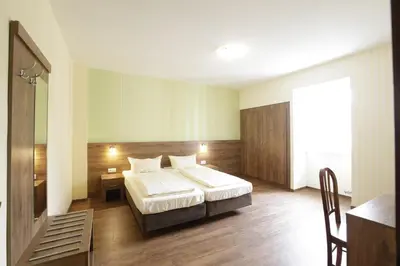 Ein Bett oder Betten in einem Zimmer der Unterkunft Hotel am Markt Sankt Goar