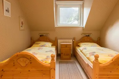 Ein Bett oder Betten in einem Zimmer der Unterkunft Ferienwohnung Burg Eltz
