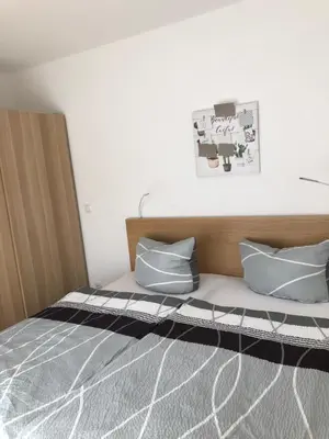 Ein Bett oder Betten in einem Zimmer der Unterkunft Fewo Rhein-Lahn OG2-2