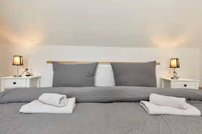 Ein Bett oder Betten in einem Zimmer der Unterkunft Haus am Hafen