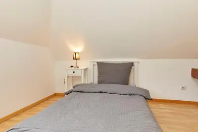 Ein Bett oder Betten in einem Zimmer der Unterkunft Haus am Hafen