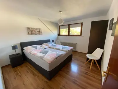Ein Bett oder Betten in einem Zimmer der Unterkunft Haus am Hang