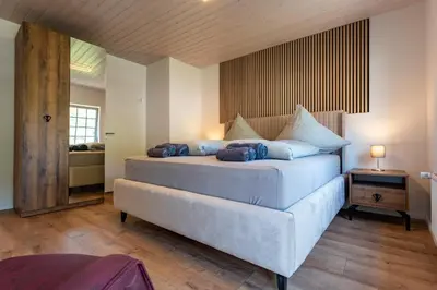 Ein Bett oder Betten in einem Zimmer der Unterkunft Moselresidenz Bellevue Alf Apartment Arrastal