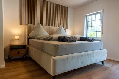 Ein Bett oder Betten in einem Zimmer der Unterkunft Moselresidenz Bellevue Alf Apartment Arrastal