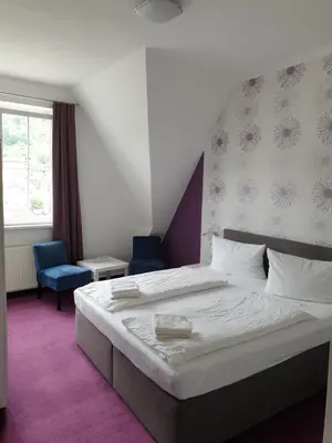 Ein Bett oder Betten in einem Zimmer der Unterkunft Haus Burgfrieden Cochem