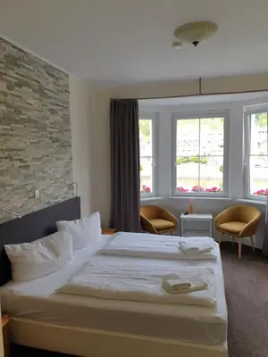 Ein Bett oder Betten in einem Zimmer der Unterkunft Haus Burgfrieden Cochem
