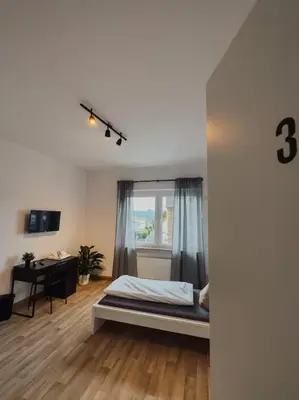 Ein Bett oder Betten in einem Zimmer der Unterkunft Geräumige 3-Schlafzimmer-Wohnung in Koblenz nahe Uni