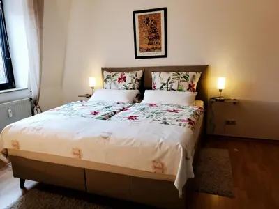 Ein Bett oder Betten in einem Zimmer der Unterkunft Komfort FeWo Stadt Mitte
