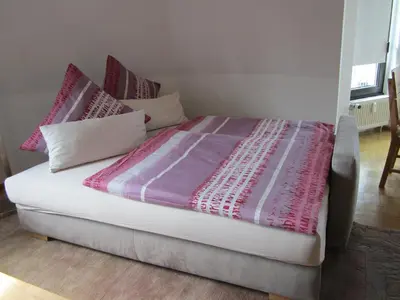 Ein Bett oder Betten in einem Zimmer der Unterkunft Komfort FeWo Stadt Mitte
