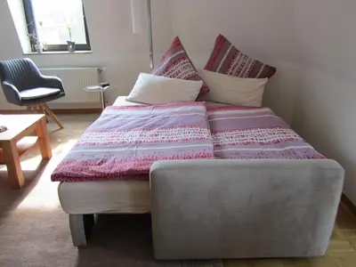 Ein Bett oder Betten in einem Zimmer der Unterkunft Komfort FeWo Stadt Mitte