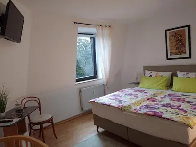 Ein Bett oder Betten in einem Zimmer der Unterkunft Komfort FeWo Stadt Mitte