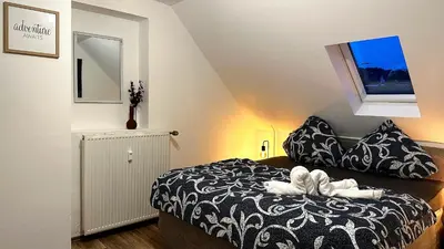 Ein Bett oder Betten in einem Zimmer der Unterkunft Moderne Zentrale FeWo City Retreat