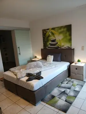 Ein Bett oder Betten in einem Zimmer der Unterkunft Ferienwohnung May