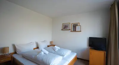 Ein Bett oder Betten in einem Zimmer der Unterkunft Haus Koinonia