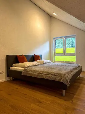 Ein Bett oder Betten in einem Zimmer der Unterkunft Traumferienhaus Leimbach am Nürburgring