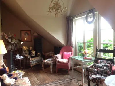 Ein Sitzbereich in der Unterkunft All Seasons Bed & Breakfast