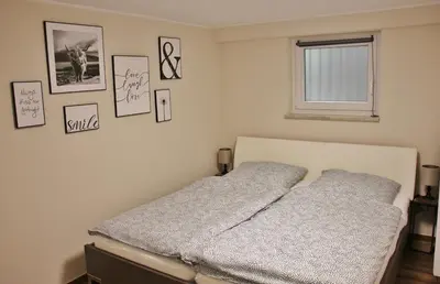 Ein Bett oder Betten in einem Zimmer der Unterkunft Ferienwohnung am Rosenberg