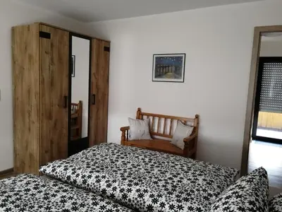 Ein Bett oder Betten in einem Zimmer der Unterkunft Eifelferienwohnungen 